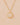 Gold necklace with a face pendant on a beige background