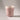 Pink ceramic cup on a gray background