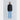 Person wearing a black blazer and light blue pants on a white background