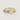 Gold ring with colorful gemstones on a light gray background