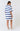 Person wearing a blue and white striped dress on a plain background