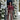 Woman standing in front of a door decorated with floral garlands