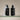 Two black bottles with pump dispensers labeled 'Paradiso del Sole' and 'Lumira' on a beige background.