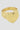 Gold heart-shaped ring on a light gray background