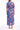 Adella Valencia Ankle Dress crafted from 100% cotton featuring a vibrant blue and red floral print shown in a back product view.
