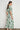 Back view of the Admire Dress in garden paisley with a fit-and-flare midi silhouette and botanical green ornate motifs.