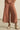 Maple Zoe Kratzmann pants with lace detailing worn by a person on a neutral background