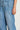 Ascend Pant Mid Wash Denim detail view highlighting the coin pocket and high-rise waistband construction.