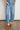 Ascend Pant Mid Wash Denim front view featuring a high-rise silhouette, elasticated drawcord waistband, and front patch pockets in mid wash denim.