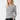 Aspyn Long Sleeve side view featuring thumb holes and soft velvet jersey fabric.