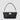 Aurora Bag in black leather featuring a structured silhouette, front flap, light gold clasp, and a short shoulder strap.