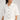 Barrymore Shirt featuring a relaxed silhouette, collared neckline, and button-through front in white broderie anglaise.