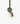Beaded pom pom bell green shown hanging vertically to highlight its handcrafted green beaded pompom and charming bell.
