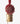 Beaded pom pom bell red close-up view displaying the intricate handcrafted red beaded pompom and golden brass bell.