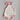 Bloom Pointelle Tie Romper soft cream pointelle knit baby bodysuit featuring playful pink trim, frilled legs, and yellow and pink Cosmos embroidery shown in a front flat lay view.