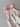 Bloom Pointelle Tie Romper soft cream pointelle knit baby bodysuit featuring adjustable pink tie shoulders and delicate Cosmos floral embroidery shown in a close up view.