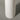 Tapered base of the Boucle Floor Lamp wrapped in neutral boucle fabric and iron.