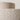 Close-up of the neutral boucle fabric wrapping the cylindrical shade of the Boucle Floor Lamp.