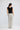 Boulevard Pant in Ivory Spot shown from the back, featuring a smooth elasticated waistband and a relaxed, full-length straight cut.