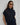 Carrie Zip Top knitted from 100% Pima cotton in an open stitch featuring a half-zip funnel neck and relaxed fit in navy shown in a front studio view.