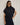 Carrie Zip Top knitted from 100% Pima cotton in an open stitch featuring a half-zip funnel neck and relaxed fit in navy shown in a standing view.