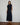 Casey Fringe Skirt knitted from 100% Pima cotton featuring fringe detailing and a maxi length silhouette in navy shown in a front view.