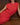 Casey Fringe Tank fine knit with fringe detailing and ribbed neckline in red shown in a close up view.