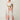 Model showing movement in the Cattleya linen maxi dress featuring the exclusive Nautilus Bloom print and separate belt.