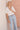 Celeste Pant Daisy lifestyle close-up view styled with a white top, highlighting the versatile mid-rise waist and utility-style design.