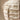 Detailed close-up of the tactile, fossilized ceramic finish and grid pattern on the Chalky ridged vase.