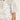 Charm Top Painterly Bloom sleeve detail showcasing insert trim around armholes and short tulip sleeves in painterly bloom.