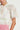 Charm Top Painterly Bloom sleeve detail showcasing insert trim around armholes and short tulip sleeves in painterly bloom.