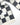 Checkered black and white blanket with 'Maison Deux' label on a white background