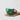 Chino Daisy Mug in green adorned with light daisy patterns and a matching handle.