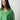 Model wearing the classic V-neck sweater in green featuring a V-neckline and soft knit texture.