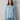 Front view of the lightweight Clouded Knit Long Sleeve Top in Siren Blue finished at the hip.