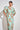 Coast Dress in mint kgari standing view showcasing pleated balloon sleeves and wide belt.