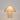 Coloured linen lamp with trim in white crafted from matte textured linen featuring contrast trim in bone linen piping along the gable edges shown lit.