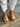 Side angled view of the Command Heel in sandcastle showcasing its supportive wide leather strap and chic contemporary profile.