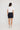 Composure Short in Navy shown from the back, featuring a back patch pocket and regular fit silhouette.