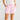 Coral Shorts Candy Stripe featuring an elasticated waistband and drawstring closure shown in a front detail view.