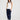 Courtney Tank in white with navy trim front view, featuring a slim fit ribbed knit design paired with navy pants.
