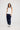 Courtney Tank in white with navy trim front view, featuring a slim fit ribbed knit design paired with navy pants.