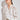 Depart Top in elm side view showing the relaxed fit and polyester lace texture.