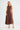 Dickens linen dress in chocolate with a sleeveless design and round neckline.