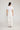 Donnie Pant White featuring back patch pockets and a full-length silhouette viewed from the back.