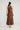 Edris Dress Chocolate featuring a button and elastic length closure viewed from the back.