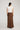 Edris Skirt featuring a maxi length silhouette in chocolate viewed from the back.