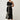 Elodie One Shoulder Embroidery Dress Black movement view showing the side splits for ease of movement and relaxed styling.