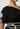 Elodie One Shoulder Embroidery Dress Black sleeve detail view displaying the intricate contrast ivory embroidery detailing.